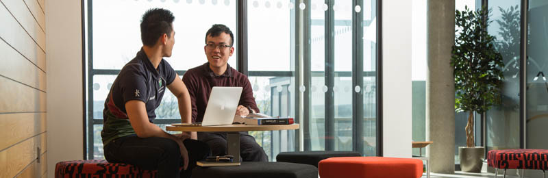 two students working in the Liberty Building