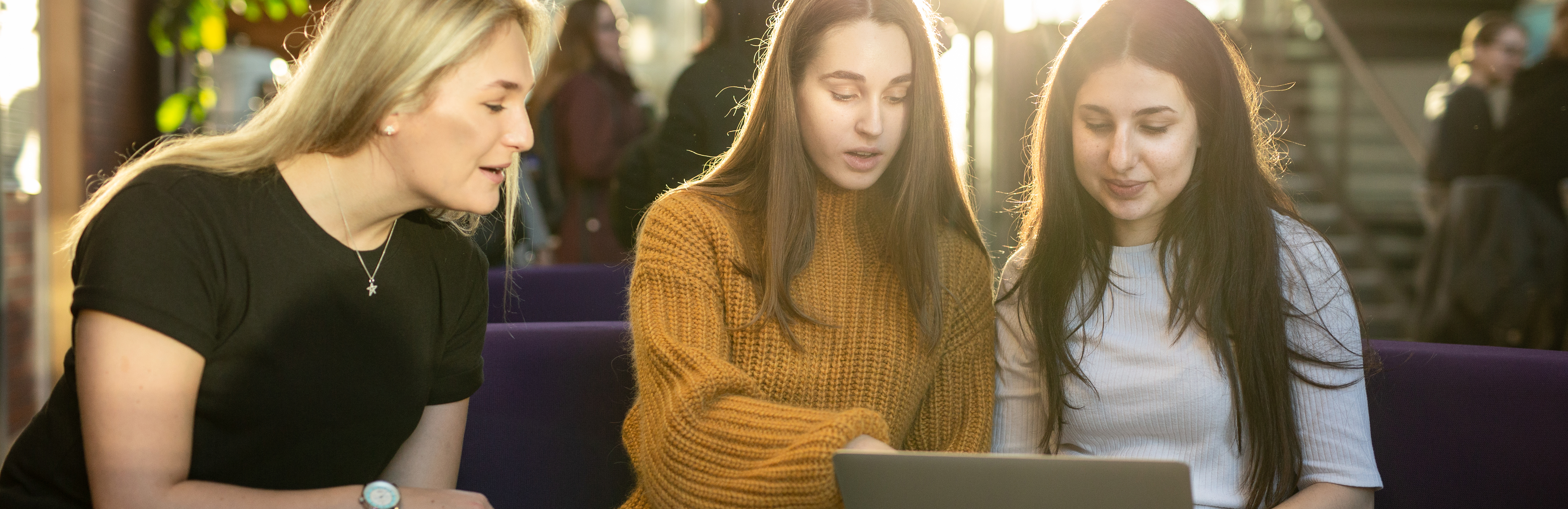 Students with laptop in the Charles Thackrah building