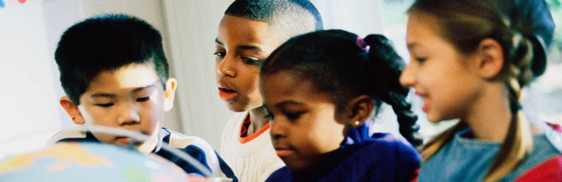children around a globe
