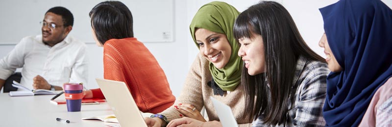 Students debating in seminar room