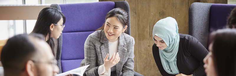 Social sciences students work together in a study area