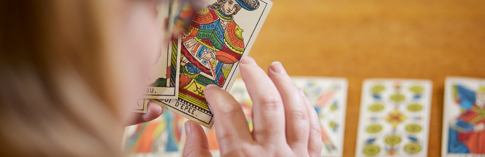 Student looking at tarot cards