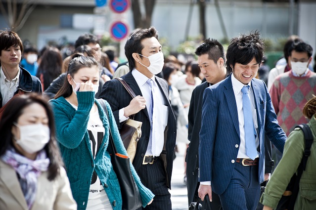 people wearing face masks to protect from pollution and viruses