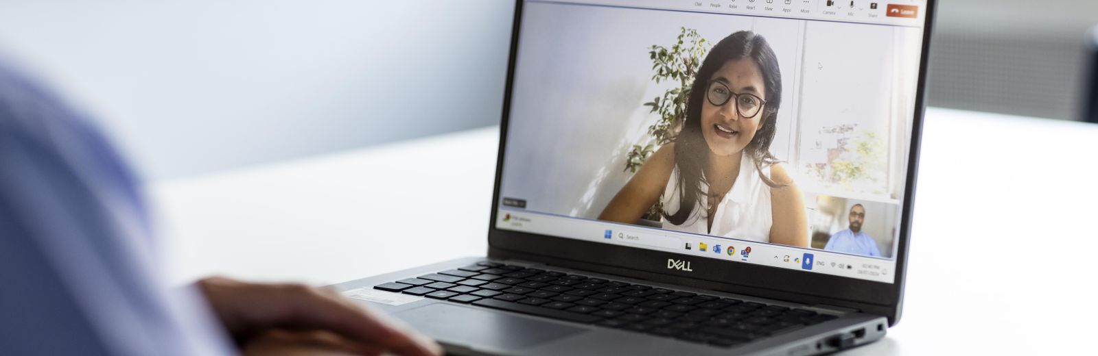 Laptop shows student on a Teams call with their lecturer