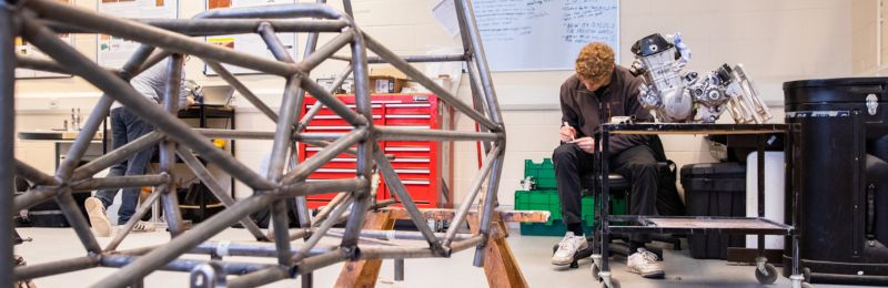 A student working on a racing frame in a workshop at the University of Leeds.