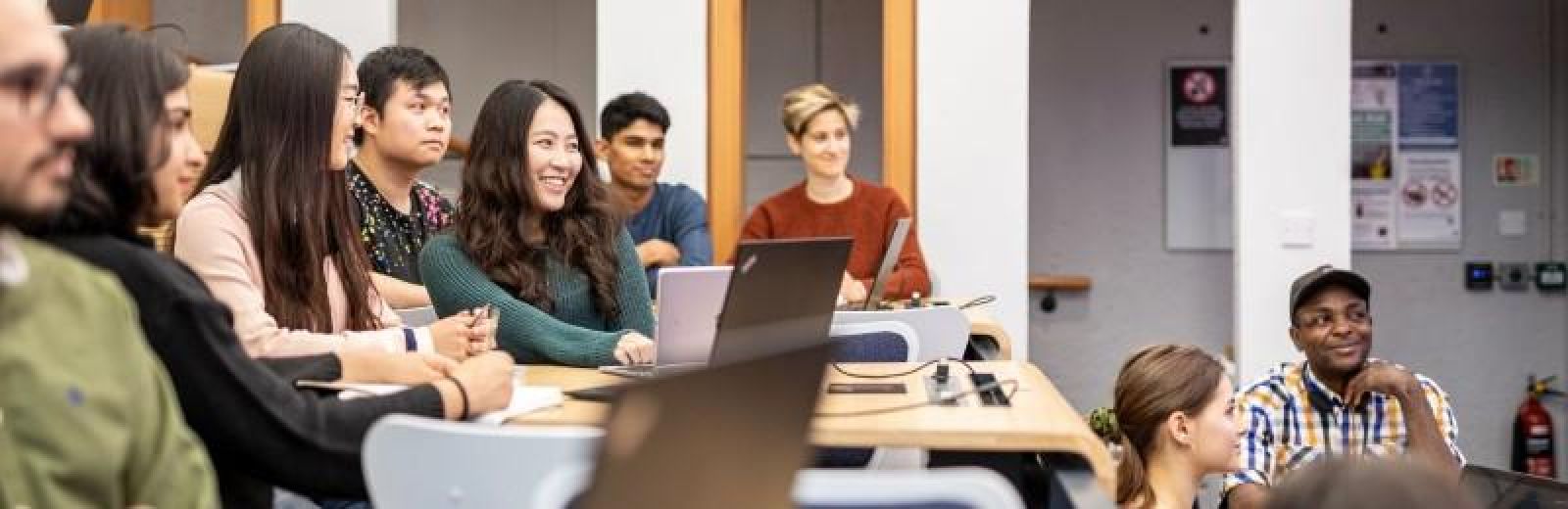A group of students attending a lecture at Roger Stevens.