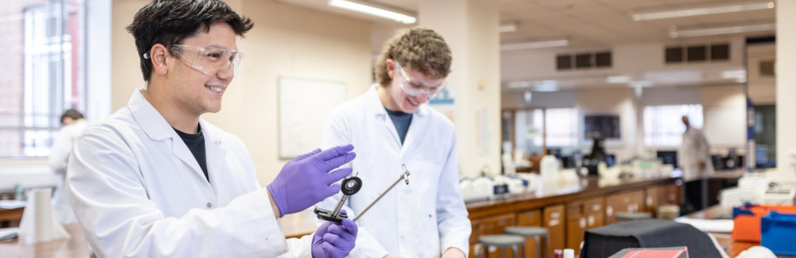 Male students doing experiments in the chemistry lab