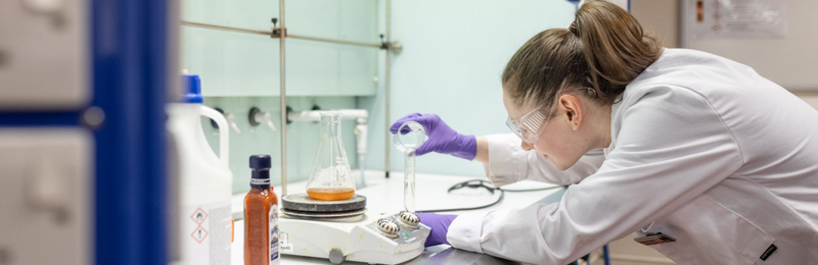 Female student doing experiment in the chemistry lab