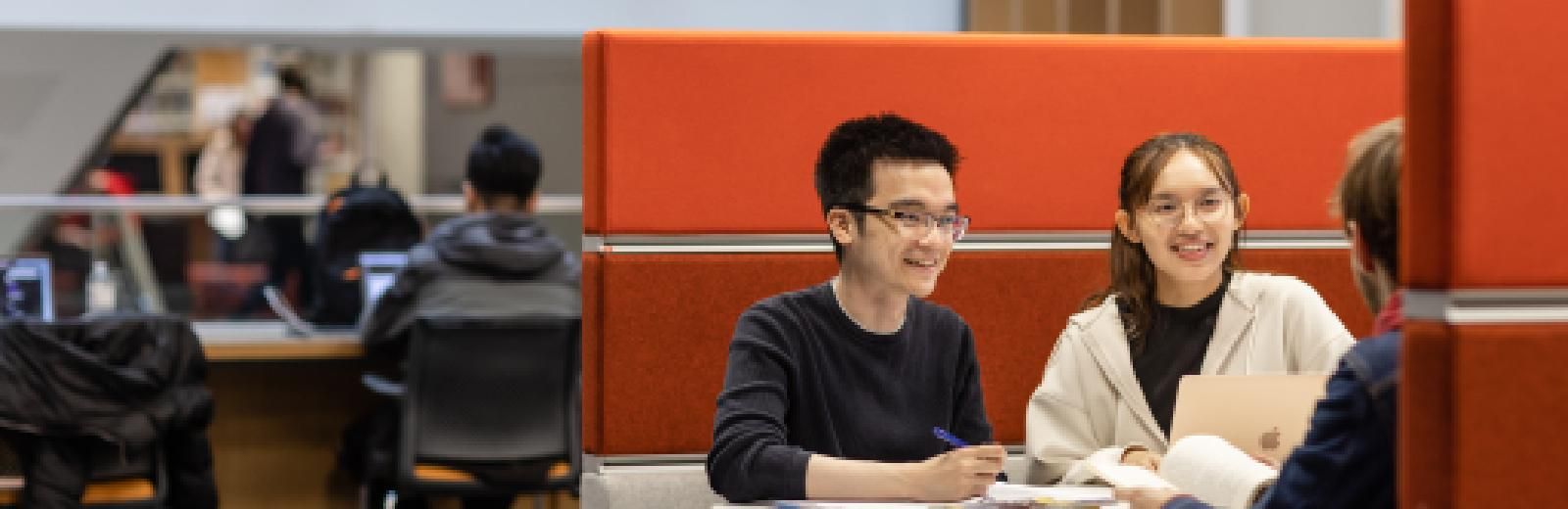 Three students working together in the library,