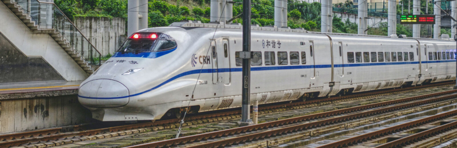 A grey train at a station