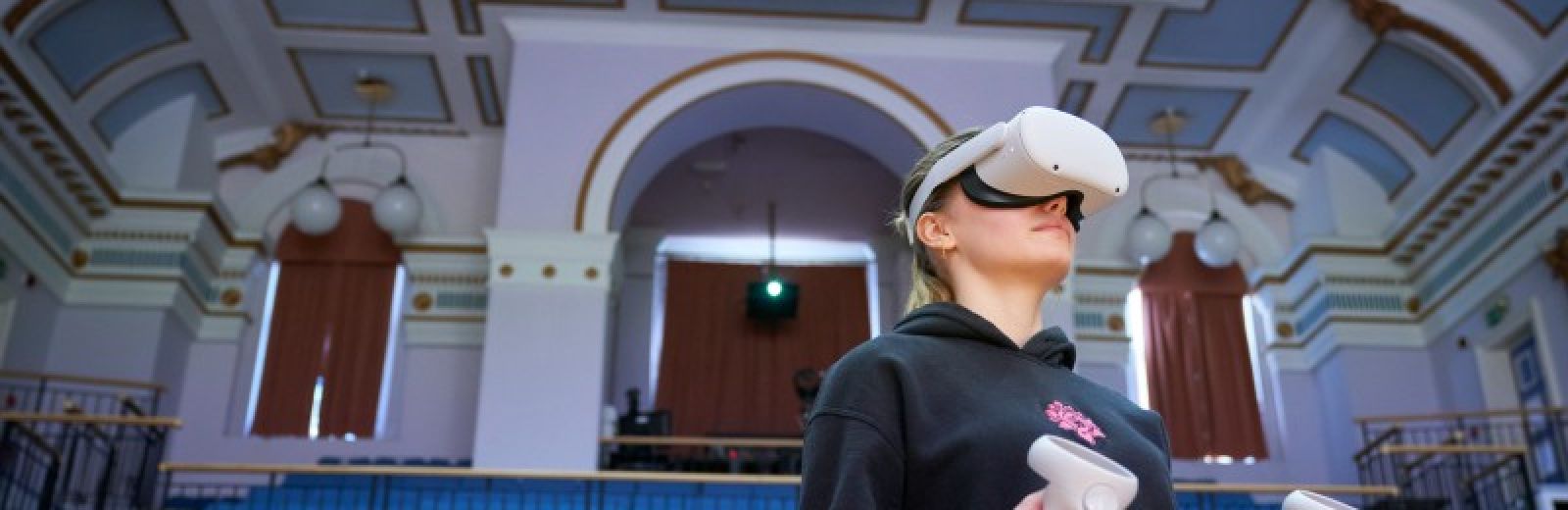 student in workshop wearing virtual reality head set