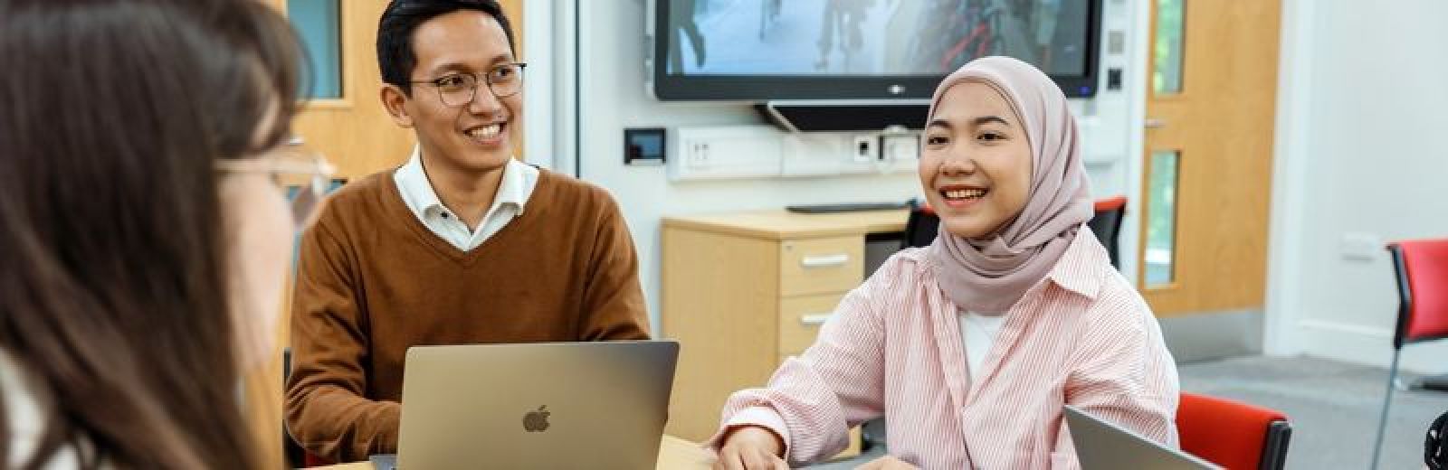 Image of two students working on laptops during an ITS seminar