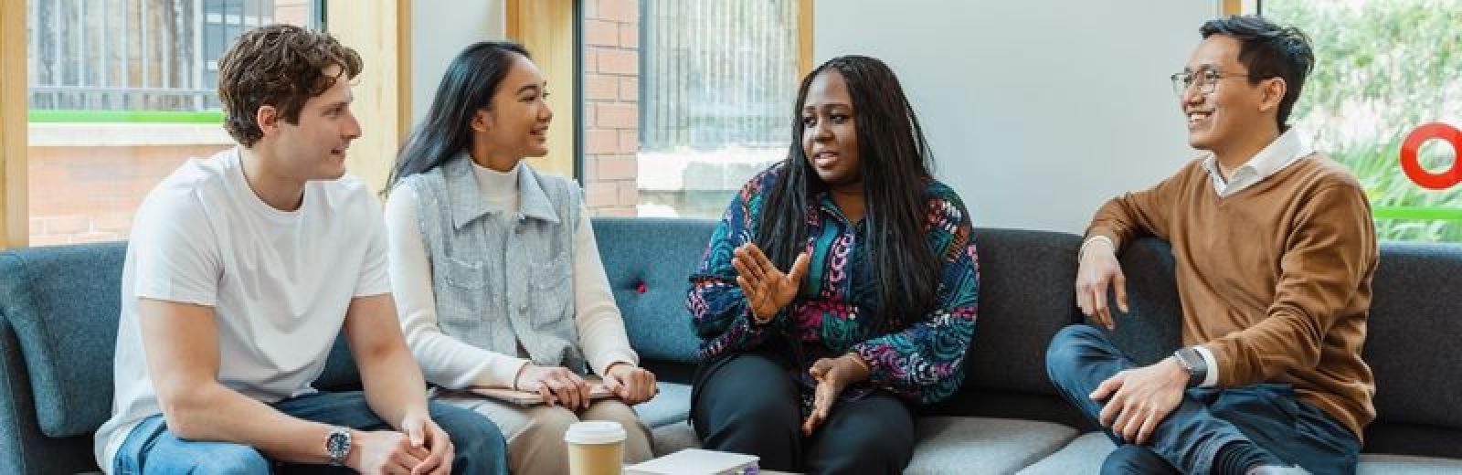 Image of students sat talking in the Institute for Transport Studies foyer