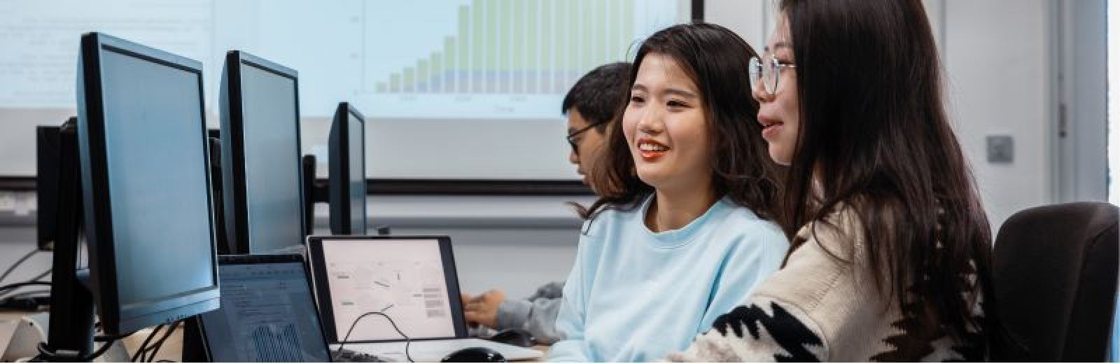 Image of two girls working in the geography computer lab