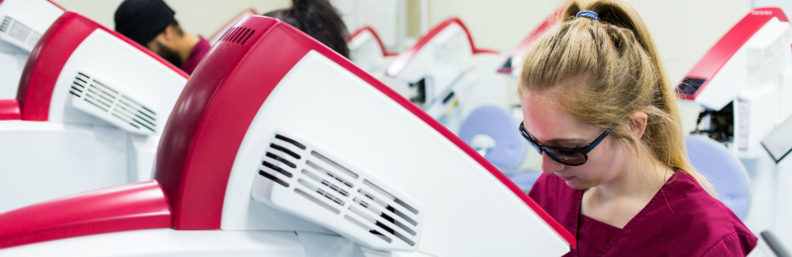 Dentistry student using equipment