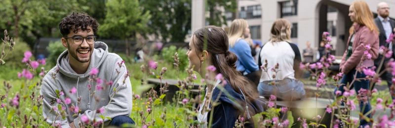 Students talking in sustainable garden